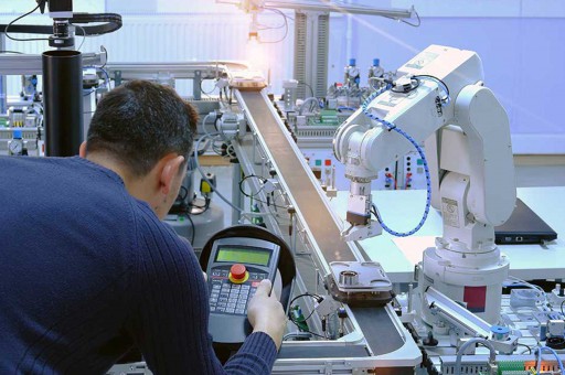 man looking at machinery